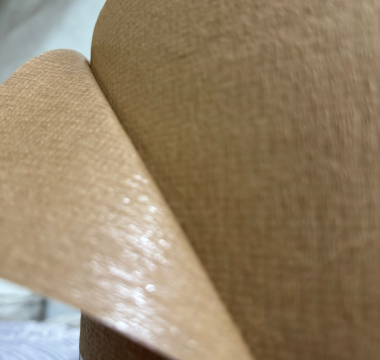 Polyethylene-coated paper used in food packaging to resist moisture and grease