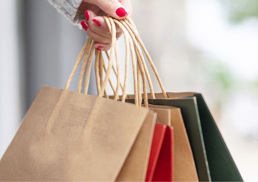 Luxury bag reinforced with kraft paper for strength and sustainability