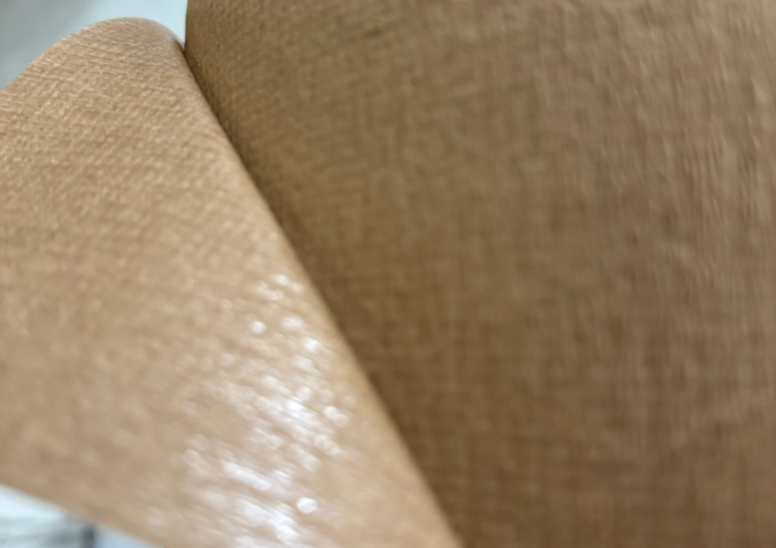 Polyethylene-coated paper used in food packaging to resist moisture and grease