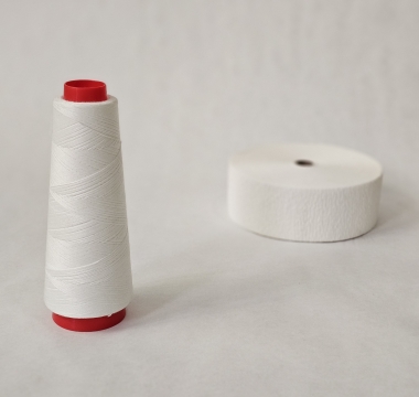 Paraffin-coated polyester thread