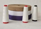 Paraffin-coated polyester thread